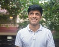 Smart Indian man in white standing outdoors Royalty Free Stock Photo