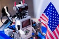 Smart innovative robot looking at the US flag