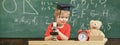 Smart kid concept. Child on happy face holds microscope. First former interested in studying, learning, education. Kid Royalty Free Stock Photo