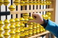 Smart kid counting on soroban abacus. Child studing at mental arithmetic school