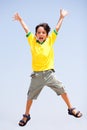 Smart kid jumping high in air Royalty Free Stock Photo