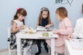 Smart kids learning in prescool class. Female chlidren play in kindergarten Royalty Free Stock Photo