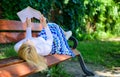 Smart lady relaxing. Girl lay bench park relaxing with book, green nature background. Woman spend leisure with book Royalty Free Stock Photo