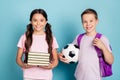 Smart a-level students ready back 1-september school concept. Two little kids girl boy hold soccer ball pile stack books Royalty Free Stock Photo