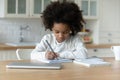 Little biracial girl study at home on quarantine Royalty Free Stock Photo
