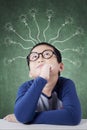 Smart little boy with branchy light bulb Royalty Free Stock Photo