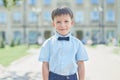 Smart little schoolboy in shirt and butterfly