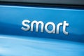 Smart logo sign on blue car rear - Smart is the mini concept car brand of electric automotive