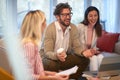 A smart looking businessman at a meeting having a good time with his female colleagues. People, business, meeting Royalty Free Stock Photo