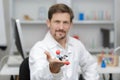 Smart male scientist looking at dna model Royalty Free Stock Photo