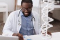 Smart male scientist studying genetics Royalty Free Stock Photo