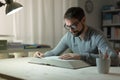 Smart man studying at night Royalty Free Stock Photo