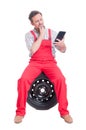 Smart mechanic reading from wireless tablet Royalty Free Stock Photo