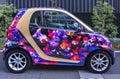 Smart microcar adorned with Japanese goldfishes swimming at the Art Aquarium Goldfish Museum.