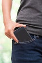 Smart mobile phone in jeans pocket Royalty Free Stock Photo