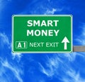 SMART MONEY road sign against clear blue sky Royalty Free Stock Photo