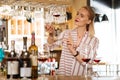 Smart nice female sommelier checking wine quality Royalty Free Stock Photo