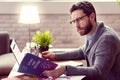 Smart nice man reading a book about astrology Royalty Free Stock Photo