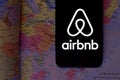 Smart phone with the Airbnb logo