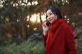 Smart phone Autumn woman talking on mobile in fall Royalty Free Stock Photo