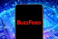 Smart phone with the BuzzFeed logo that is an Internet media company.