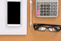 smart phone, calculator, ballpoint pen, empty notebook, eyeglass Royalty Free Stock Photo