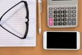 smart phone, calculator, ballpoint pen, empty notebook, eyeglass Royalty Free Stock Photo