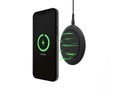 Smart phone charging on black wireless charger Royalty Free Stock Photo