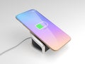 Smart phone charging on wireless charger Royalty Free Stock Photo