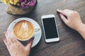 Smart phone and coffee Royalty Free Stock Photo