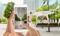 Smart phone control drone with app. City street in background Royalty Free Stock Photo