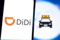 Smart phone with the Didi Chuxing Technology Co. logo, which is a transportation company