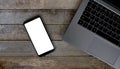 Smart phone with empty screen on wooden desk. Top view Communicator Technology On Wood Table Top View Royalty Free Stock Photo