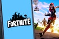 Smart phone with fortnite logo Royalty Free Stock Photo