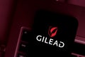 Smart phone with the Gilead Sciences, Inc. logo, is an American