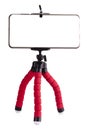The Smart Phone isolated on red tripod in white background Royalty Free Stock Photo