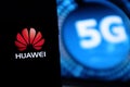 Smart phone with the logo of Huawei and 5G. The 5g are new communication technologies that Huawei