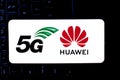 Smart phone with the logo of Huawei and 5G. The 5g are new communication technologies that Huawei