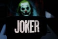 Smart phone with the logos of the JOKER 2020 movie. Joker known as Joker in Latin America