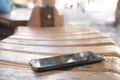 smart phone lost concept. left on park bench Royalty Free Stock Photo
