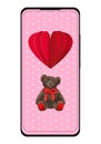 Smart phone screen with Valentine Day or birthday wallpaper. Cute teddy bear toy flying on red air balloon on pink