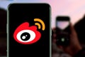 Smart phone with the Sina Weibo logo is a Chinese social networking website.