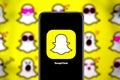 Smart phone with the Snapchat logo, a popular social network worldwide