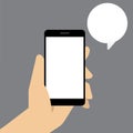 Smart phone with speech bubble in hand Royalty Free Stock Photo