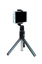 Smart Phone with a tripod on isolated white background. Royalty Free Stock Photo