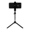 Smart phone and tripod isolated on white background Royalty Free Stock Photo