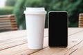 smart phone with white screen and takeaway coffee cup on wooden table surface AI generated