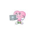 Smart pink love balloon cartoon character working with laptop