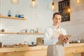 Smart pleasant man working in the bakery