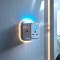 Smart plug with a Wi-Fi symbol in blue on a glossy surface, plugged into a wall outlet. It features a standard electrical socket Royalty Free Stock Photo